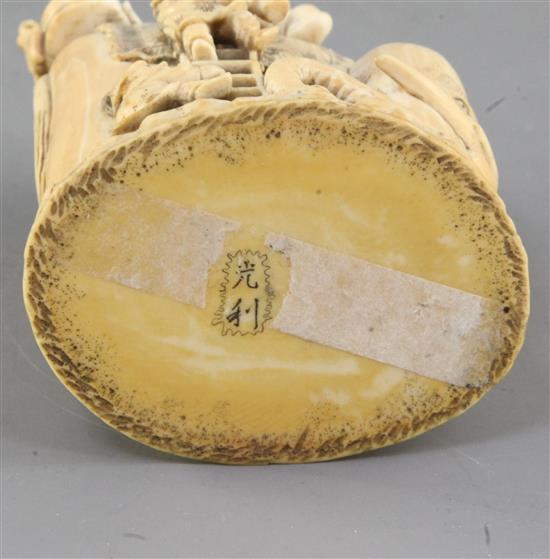 A Japanese ivory okimono of boys clambering on an elephant, Meiji period, height 9.8cm